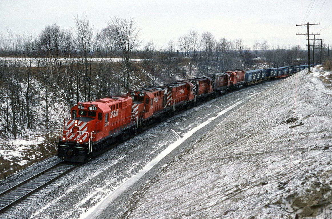 With no shortage of power CP 508 drifts down hill east bound around the curves at Audley ( Ajax ) Today's consist 1848 1824 1815 1805 4229 and 4709. The last two units on idle .
