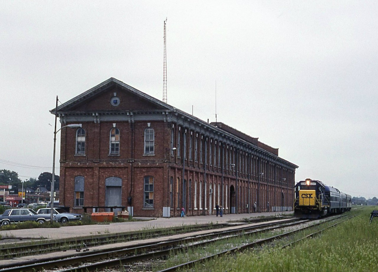 CSX management special sits in front of Conrail's historic station at St Thomas. Before being able to record the cars we where escorted off the property by a CSX special constable from the US that was riding the train.The station at St Thomas has been preserved and is still under going renovations.