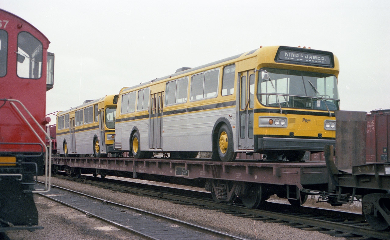Once upon a time the railroads could...and would.... deliver almost anything by train. A good example is Hamilton's order of new Flyer buses; two on a flatcar waiting to be unloaded down at Stuart St yard quite a few years ago.