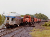 How times have changed in Parry Sound. Back in 1986 one could spend most of the day in town and be constantly busy bagging trains on both the CN and CP. Here at Parry Sound CP station we see the northbound Canadian with VIA 6313 and 6631 stopped for passengers while southbound freight #912 tries to squeeze by with CP 5519, CR 7793, CP 3073, 4715 and 4570. On the siding is CP 8747 with a work train. Not only is it rather dead there now in comparison, the tracks other than the main have been pulled up.