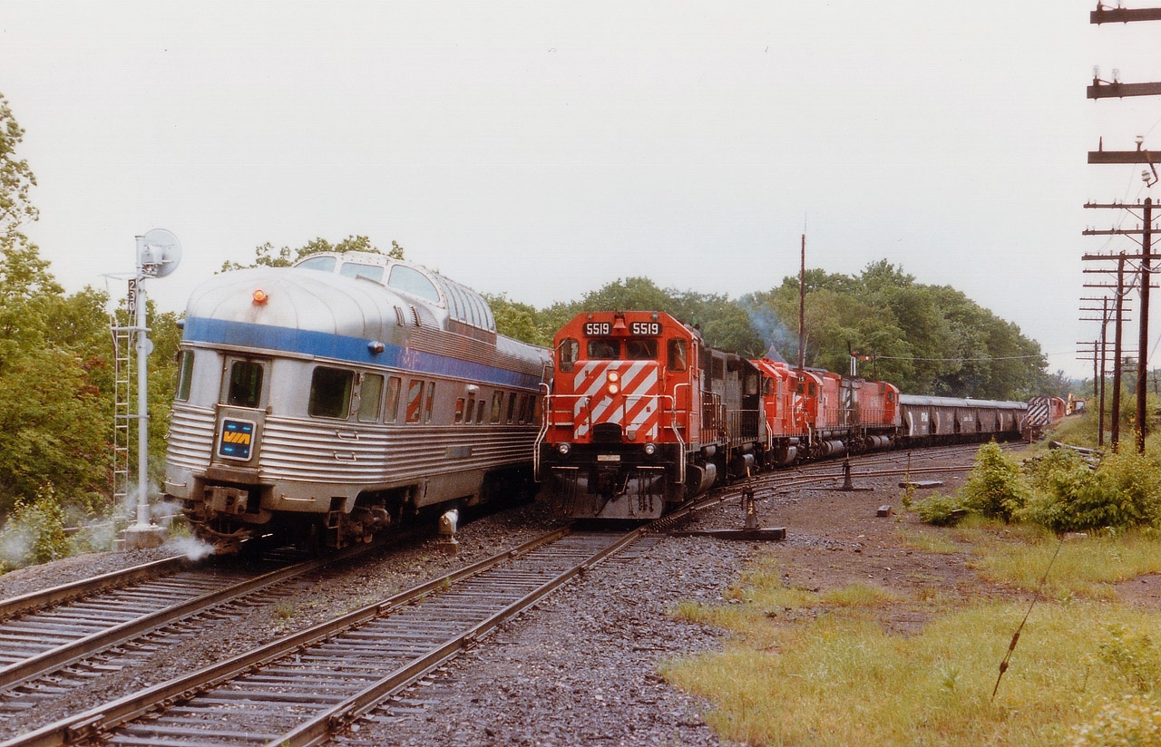 How times have changed in Parry Sound. Back in 1986 one could spend most of the day in town and be constantly busy bagging trains on both the CN and CP. Here at Parry Sound CP station we see the northbound Canadian with VIA 6313 and 6631 stopped for passengers while southbound freight #912 tries to squeeze by with CP 5519, CR 7793, CP 3073, 4715 and 4570. On the siding is CP 8747 with a work train. Not only is it rather dead there now in comparison, the tracks other than the main have been pulled up.