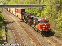A different take on Bayview...this shot is looking back from the Plains Road overpass to the pedestrian bridge commonly used by railfans. My initial intent of photographing from the overpass was to try and do a Time Machine shot to one of Arnold Mooney's shots from years before, using the east side of the bridge. However, my time was slightly constrained to get one more train, and I captured this freight.
<br>
CN 2942 and 3023 lead this eastbound intermodal train off of the Niagara Escarpment via the Dundas Sub., and rolling nicely along through Bayview onward to Vaughan. 
<br>
PS - anyone know what the white plastic units are on top of 2942's cab? I am assuming a satellite?