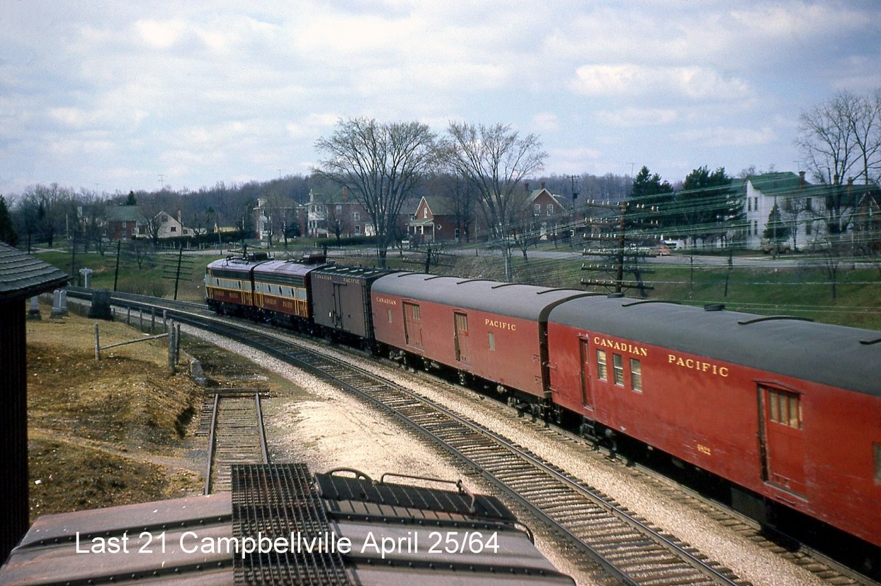 The head end of the last CP train #21, with FP9 1412 leading an F7B, express reefer, baggage and RPO (in addition to the rest of the train out of frame) passes the pond alongside the CP Galt Sub in Campbellville, approaching Guelph Junction for its station stop.

The train at Guelph Junction: http://www.railpictures.ca/?attachment_id=24875