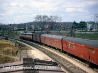 The head end of the last CP train #21, with FP9 1412 leading an F7B, express reefer, baggage and RPO (in addition to the rest of the train out of frame) passes the pond alongside the CP Galt Sub in Campbellville, approaching Guelph Junction for its station stop.
<br><br>
The train at Guelph Junction: <a href=http://www.railpictures.ca/?attachment_id=24875><b>http://www.railpictures.ca/?attachment_id=24875</b></a>
