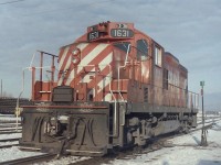 Another cold winter day at Cranbrook. I guess my age must be getting to me as I have no idea why I was there on that date, but it must have been work related. As for the snow, I never had much luck taking pictures that combined snow & bright light. Catching CP 1631 at work is great, but the man at the switch is what caught my eye. It shows what his life was like in the winter. He was an important part of railway operations that seldom got the credit that it deserved. The people on the ground who make things work, they are the important ones.