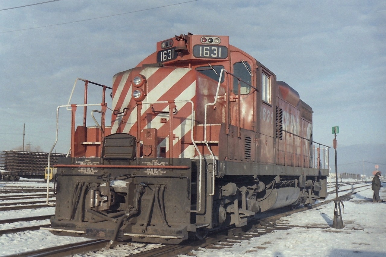 Another cold winter day at Cranbrook. I guess my age must be getting to me as I have no idea why I was there on that date, but it must have been work related. As for the snow, I never had much luck taking pictures that combined snow & bright light. Catching CP 1631 at work is great, but the man at the switch is what caught my eye. It shows what his life was like in the winter. He was an important part of railway operations that seldom got the credit that it deserved. The people on the ground who make things work, they are the important ones.