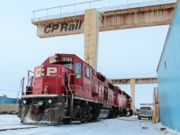 Parked under the huge electric overhead cranes at Vaughan container terminal, GP38-2 waits for a crew change on a crisp February day. Apparently the cranes are now out of service and may be sold off.