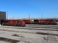 A pair of GE's are shopped for maintenance. ES44AC 8794 is having radiator parts changed out while AC4400 is having running checks performed. AC4400 9568 sits in storage.