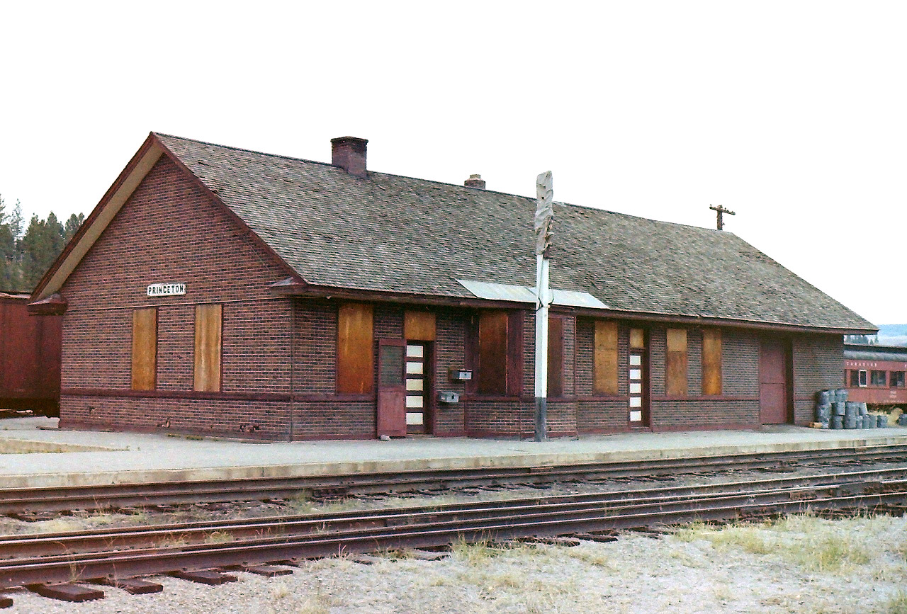 The CP yards in Princeton were located just south of BC highway #3. I was on my way back to Vancouver when I saw the cars from the CP work train, so I pulled over to see if I could get a few pictures. I took a bit of time & walked around the station area. The station was a wood frame structure built from a simple design. The exterior of the building was covered with what I called "insul brick" a material that gave some addition insulation to the building. There was one CP truck parked near the station, but there was no activity taking place. A few years later all was gone.
Princeton is a neat little BC interior town. It is like an oasis in a desert of trees. A great place to stop, buy fuel, & eat.