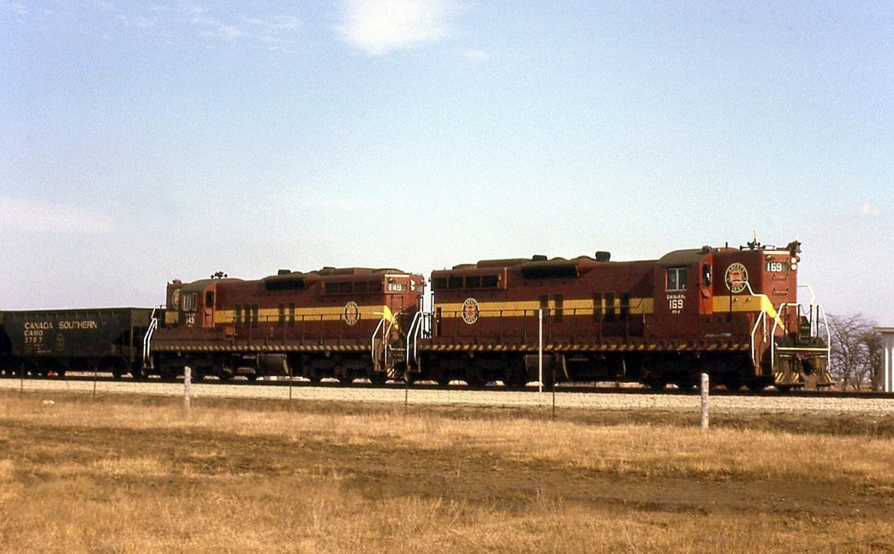 A pair of Duluth, Missabe & Iron Range Railway SD9's, 169 & 149, handle a westbound freight on the new "bypass" portion of CN's Halton Sub at Halwest in March 1966. Of note, trailing behind the power is a Canada Southern (CASO) lettered triple hopper.

The Halton and York Sub trackage between Halwest and Pickering was constructed on the suburban outskirts of Toronto in the early-mid 1960's (completed 1965) to divert freight traffic around the top end of city, freeing up track time downtown to allow GO Transit train service to commence on the Oakville/Kingston Sub rail corridors in 1967.
