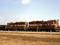 A pair of Duluth, Missabe & Iron Range Railway SD9's, 169 & 149, handle a westbound freight on the new "bypass" portion of CN's Halton Sub at Halwest in March 1966. Of note, trailing behind the power is a Canada Southern (CASO) lettered triple hopper.
<br><br>
The Halton and York Sub trackage between Halwest and Pickering was constructed on the suburban outskirts of Toronto in the early-mid 1960's (completed 1965) to divert freight traffic around the top end of city, freeing up track time downtown to allow GO Transit train service to commence on the Oakville/Kingston Sub rail corridors in 1967.