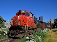 <b>A Dash9-44CWL leader.</b> In faded paint, veteran Dash9-44CWL CN 2510 leads CN 149 out of the Port of Montreal. The third unit is another Dash9-44CWL (CN 2520), with an even older GE (Dash8-40CM CN 2429) in second position.