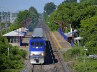 <b>Departing Cedar Park Station.</b> AMT 50 departs Cedar Park station with AMT 1328 leading on a gorgeous morning.