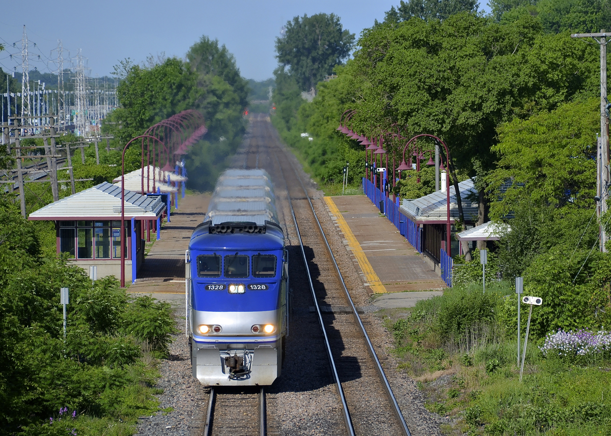 Departing Cedar Park Station. AMT 50 departs Cedar Park station with AMT 1328 leading on a gorgeous morning.