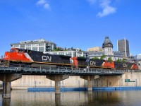<b>The other side of the bridge.</b> I've shot CN 149 in the Port of Montreal on the other side of this bridge over the Lachine Canal quite often during the past 6 months, but when the days are as long as they are now, the sun swings around enough to be able to shoot the other side of the bridge. Here CN 2205, CN 2244 & 1012 lead CN 149 on the first leg of their voyage towards Toronto and eventually Chicago. Here is <a href=http://www.railpictures.ca/?attachment_id=23445>a shot</a> from the other side of the bridge.