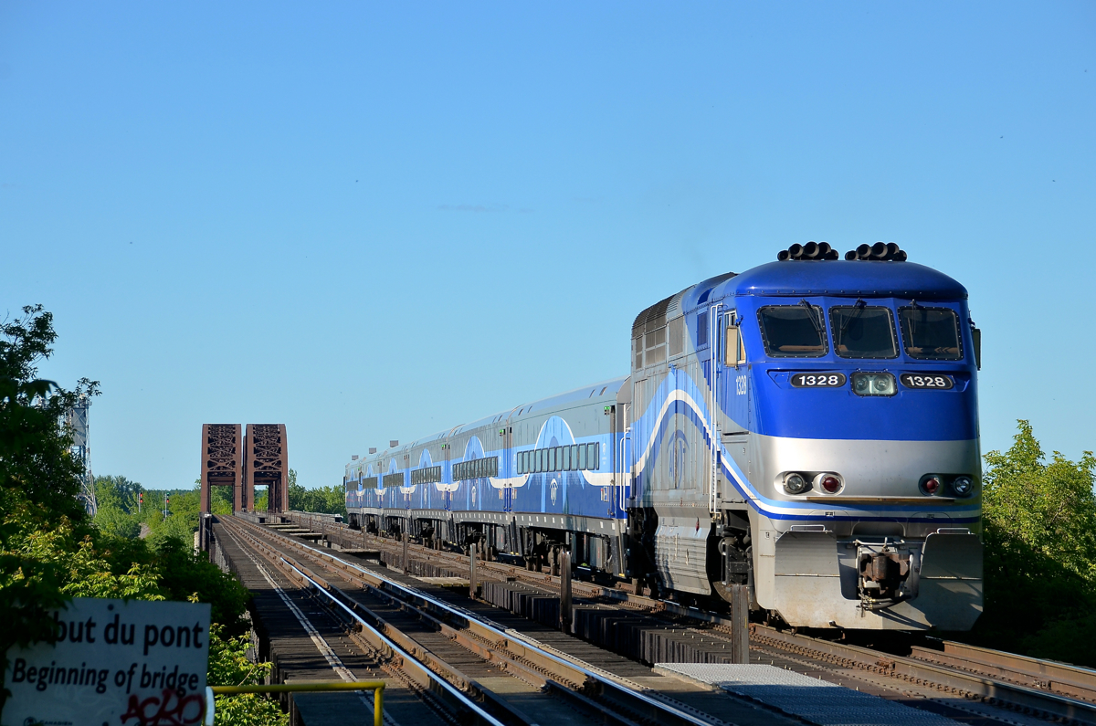 Deadhead over the river. AMT 1328 pushes a deadhead move over the St-Lawrence River, on its way to Candiac to bring more commuters to Montreal.
