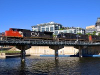 Instead of the more common trio of GEVO's, CN 149 has Dash8-40CW CN 2163, SD70 IC 1027 & SD75I CN 5711 for power as it crosses the Lachine canal as it slowly exits the Port of Montreal.