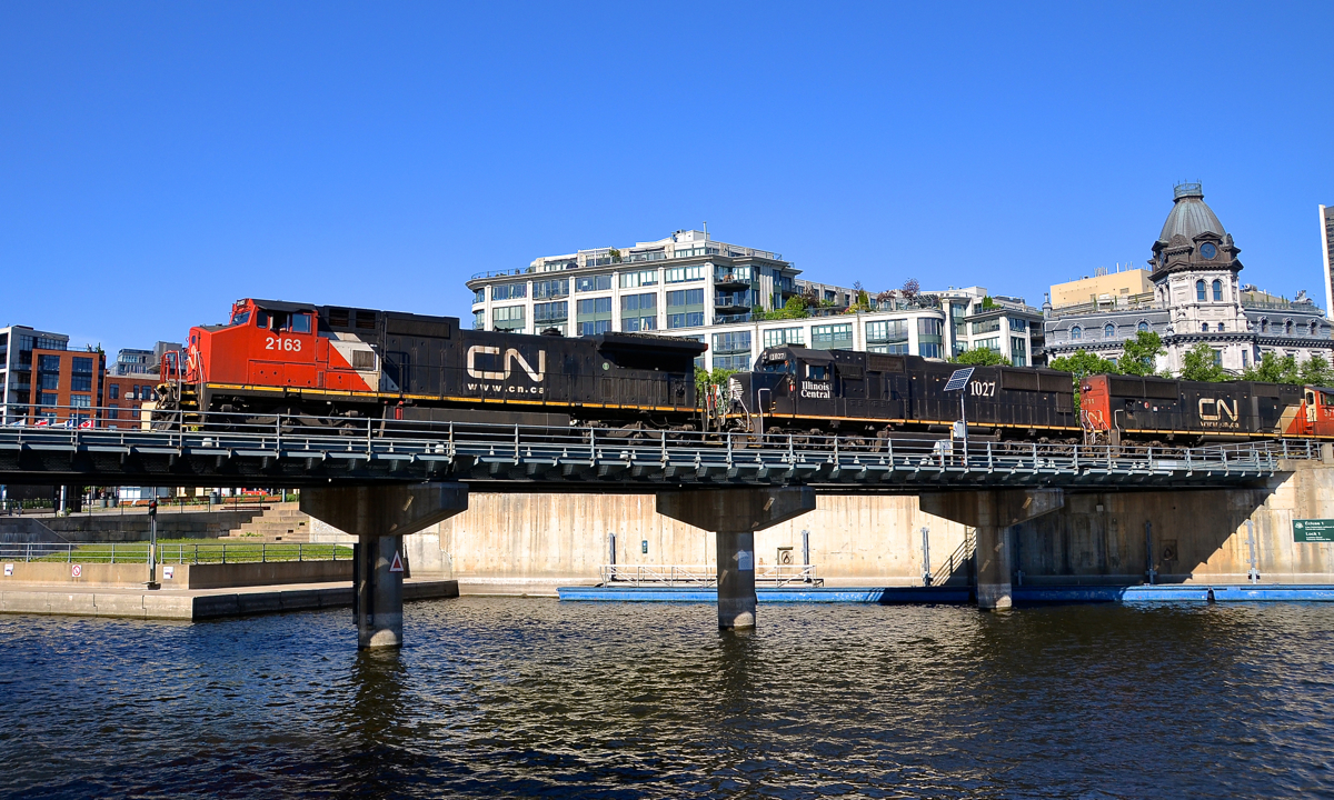 Instead of the more common trio of GEVO's, CN 149 has Dash8-40CW CN 2163, SD70 IC 1027 & SD75I CN 5711 for power as it crosses the Lachine canal as it slowly exits the Port of Montreal.