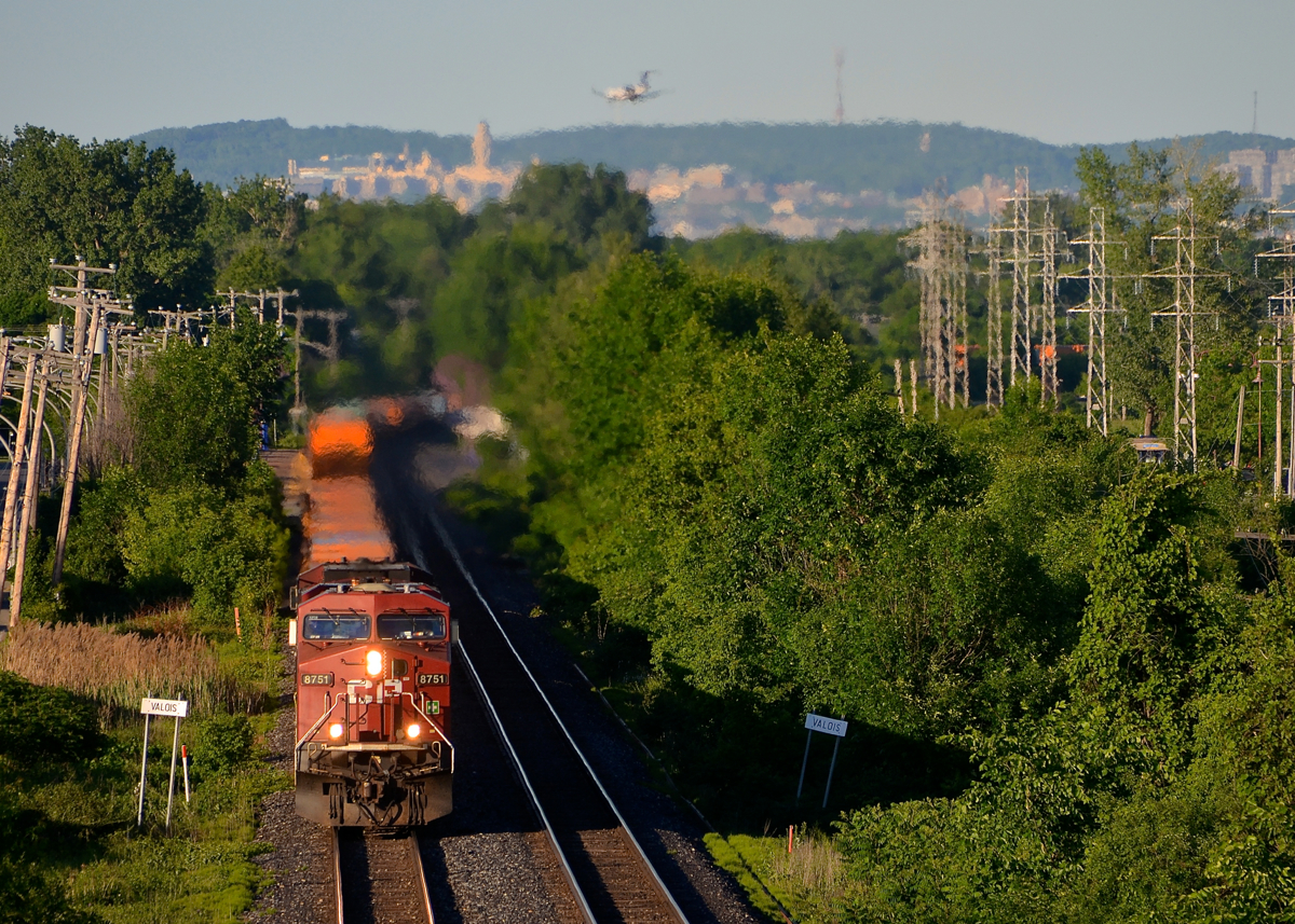 A late CP 143. A late CP 143 is through Pointe-Claire just after CP 133 passed, with CP 8751 & CP 8537 for power. The train is 100% intermodal, something which is rare recently as this train is almost always filled out with mixed freight out of Montreal.