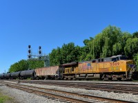<b>UP unit shoving at the rear.</b> CP 550 is bound for the U.S. with oil loads for Albany as UP 5509 shoves on the rear of the train near Lasalle station. At the head end is another UP GEVO, UP 5519.