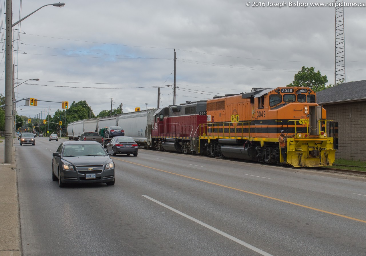On a cloudy Wednesday morning RLHH 598 heads down the Burford Spur with RLHH 3049, NECR 3840 and 5 hopper cars.  They came straight from Hamilton with the train which was a first and having two units together downtown was a first for 2016.