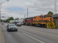 On a cloudy Wednesday morning RLHH 496 heads down the Burford Spur with RLHH 3049, NECR 3840 and 5 hopper cars.  They came straight from Hamilton with the train which was a first and having two units together downtown was a first for 2016.  