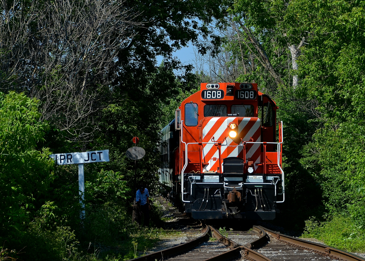 Throwing the switch. The conductor is throwing the switch so that CP 1608 can leads Exporail's excursion train to Hays Station to lay over after the last run of the day.