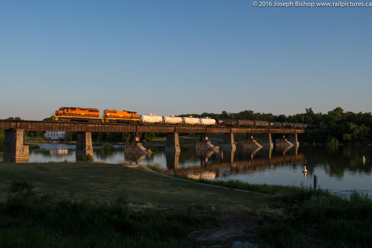 With light quickly fading SOR train 597 makes an early evening appearance in Caledonia with RLHH 3404 on the point.  Having noted an early running trend on the last few Fridays I rolled the dice and headed out to Garnet this evening.  The crew would come on duty shortly after 1900.  In this picture they are crossing the Grand River in Caledonia with the crew giving a good horn show.  It was an enjoyable chase with a friendly crew as well, a good way to end a busy week.