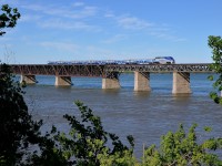 <b>Heading back to get more commuters.</b> An unknown F59PHI shoves an AMT deadhead move southbound over the St-Lawrence river, on its way to Candiac to bring more commuters to Montreal.
