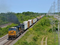 <b>Dash8 smoke.</b> The trailing Dash8-40CW on CN 327 (CSXT 7719) erupts in smoke as the train starts to accelerate after having to wait for two eastbounds to pass and CN 377 to leave ahead of it on a portion of the Kingston sub that is temporarily single track due to trackwork. Leading is CSXT 896.