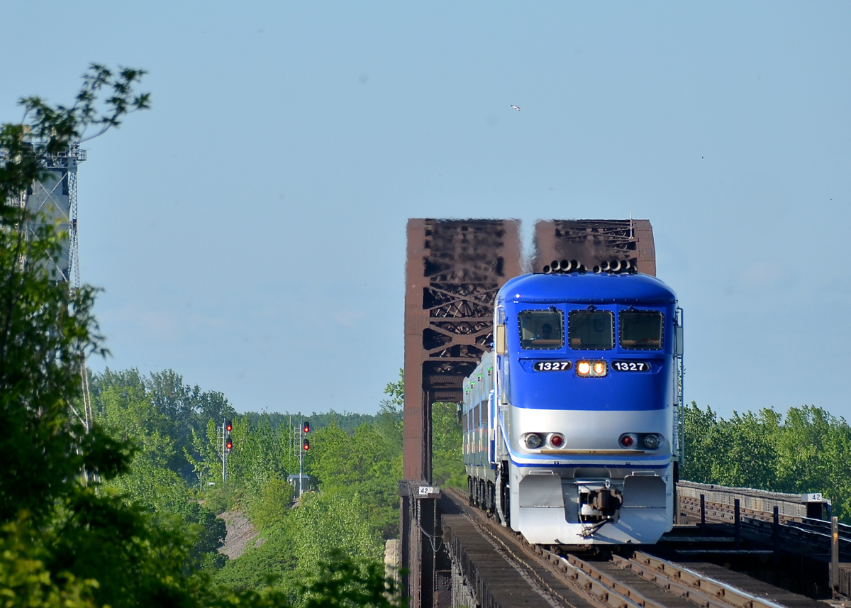 Halfway across the river. AMT 86 from Candiac is about halfway across the St-Lawrence river as it approaches the island of Montreal and its first stop at Lasalle station.