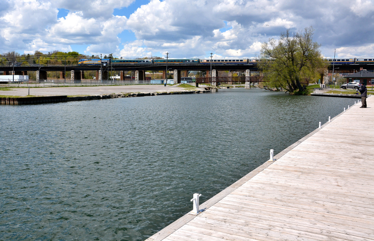 A lone fisherman works the Ganaraska channel as VIA 45 ( VIA 918 west ) rumbles by 


  May 17, 2016 digital by S.Danko 


  What's interesting: the original CN 918: 


    CN 918