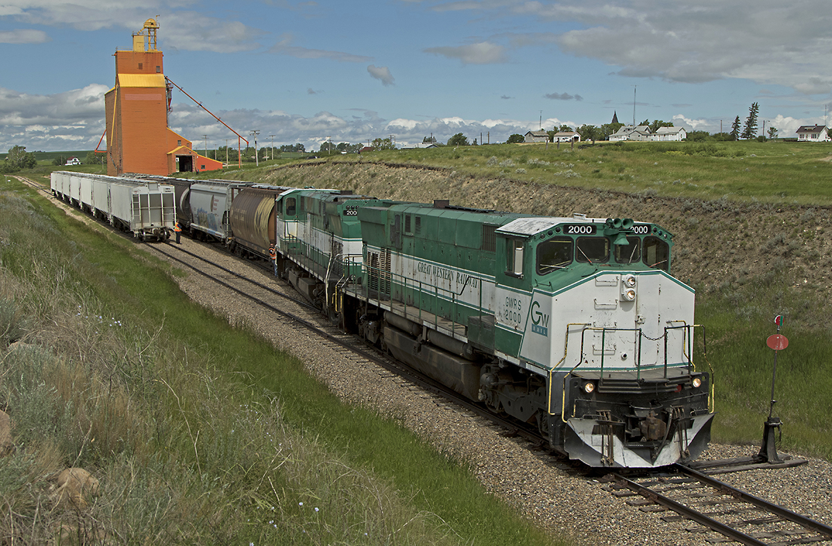 With the news of the railway placing its entire fleet of MLW M420's up for sale, time is running out for fans to catch these beasts roaming the prairies of Saskatchewan. Great Western Railway 2000 and 2001, the first MLW's purchased by the railway, lift a cut of loaded covered hoppers at the elevator in Admiral SK.