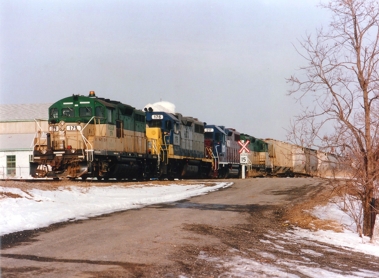 Try as I may, I just cannot warm up to the current GEXR colours as provided by the Genesee & Wyoming. That orange/black represents the G&W all over North America, and only the herald gives indication to just what road the locomotive represents. Back when it was RailAmerica, heck, anything could be expected. Something like this example of a Stratford-bound train putting everything together before it heads south. GEXR 179, HATX 176, 217 and GEXR 177. A lot of locomotives with little horsepower always makes for an interesting chase. The leasers are GP38AC and GP38-2 respectively sandwiched between the diminutive GP9s. All have long departed the GEXR.