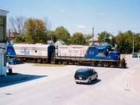 I didn't have a whole lot of luck with trains running the Exeter sub. So I enjoyed the 'chase' when I could. On this particular day I followed GEXR 3835, RLK 1401 and 4001 into Hensall. When they uncoupled from the train to pick up some cars of plastic tubing, I saw my chance to get a decent shot of 4001, which I wanted because it was still lettered for Lakeland & Waterways, and only had been in the east about 6 months. Split second decision to scurry up someone's fire escape on the main drag to get this overview. Disappointed I could not squeeze in the cab unit, but I accepted  the balance I got. When in doubt, climb something !!