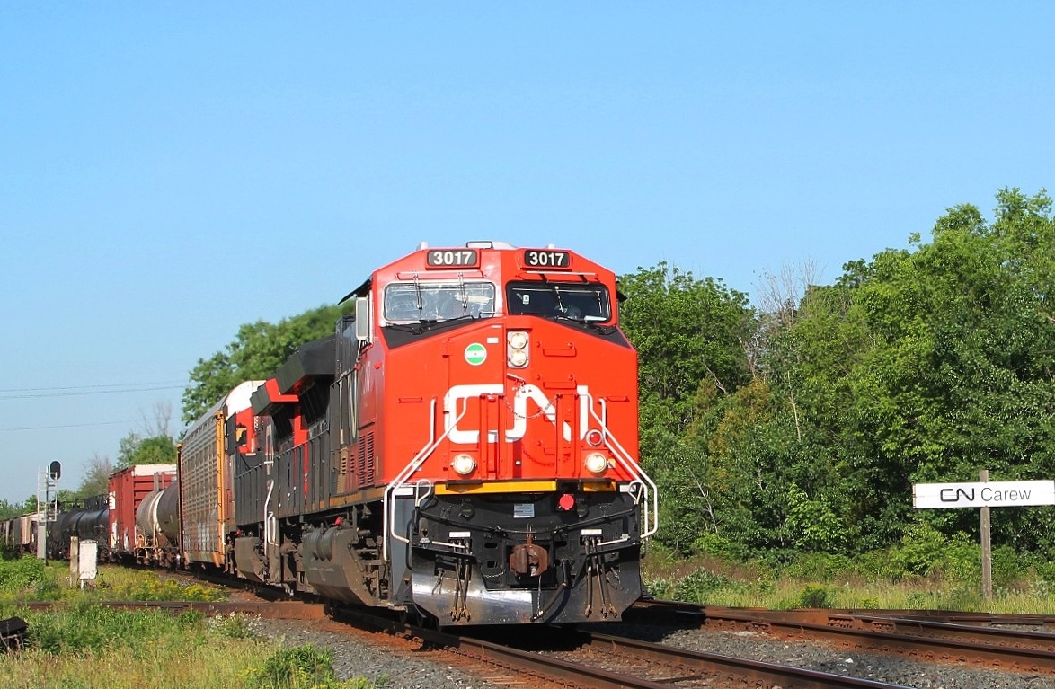 3017 and sister 3037 cross the diamond at Carew and carry on east into the early morning sun.