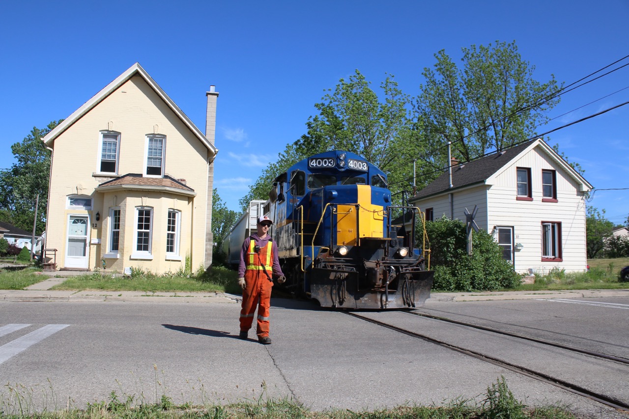 A shot that I've made many times is the one along the old Burford spur between the houses on Port Street. It is hard to believe this track once belonged to the TH&B. Now a spur that survives to serve a lone industry once a week. Ownership over the years has gone from TH&B to CP to CN to Railink then back to CN and now the SOR. These days the brakeman must flag all unsigned crossings.