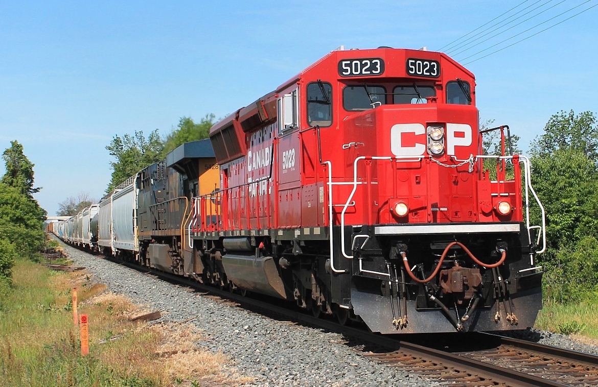 Seen at Gobles Road crossing, CP 5023 and CSX 5428 head east with train 242 towards Wolverton Yard where they will work. They left Autoracks and collected CP 3065 to take to Toronto.