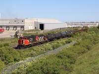 CN local 551 with a clean GP38 4761 and R/C equipped GP9RM 4138 are busy working customers on the north track at Mansewood. The train has just finished working the glass lead. 