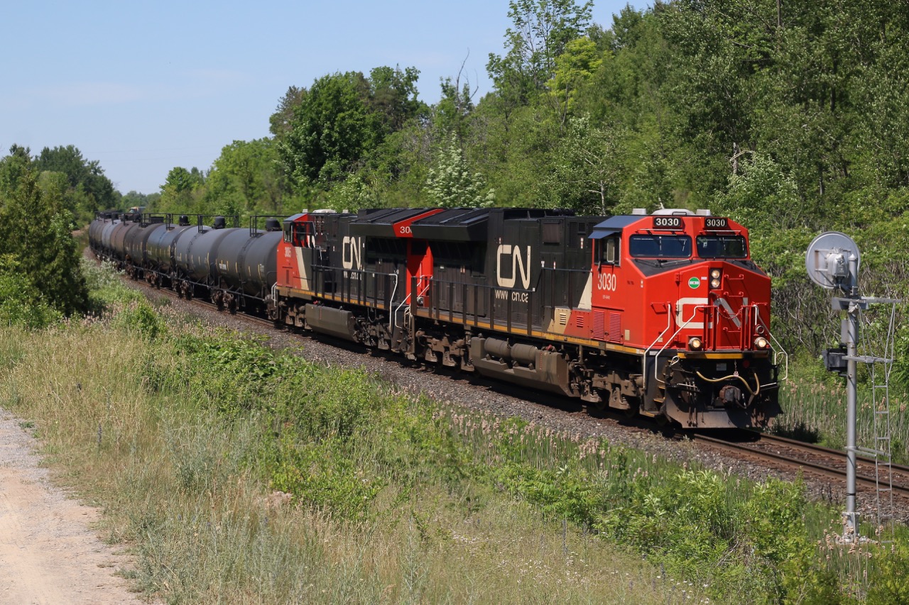 A large and not so very common CN train L570 is seen rolling through Scotch Block with a pair of GE built T4's.