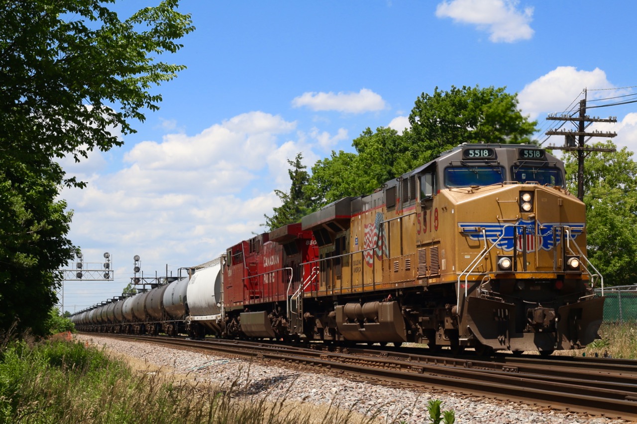 Union Pacific 5518 along with repainted CP 8504 hustle an eastbound CP crude oil train (placard #1267) through Streetsville Junction. UP GEVO 5509 is pushing hard on the tail end. I sure miss the days when DME and ICE power was common on these trains, but any foreign power these days is good foreign power.