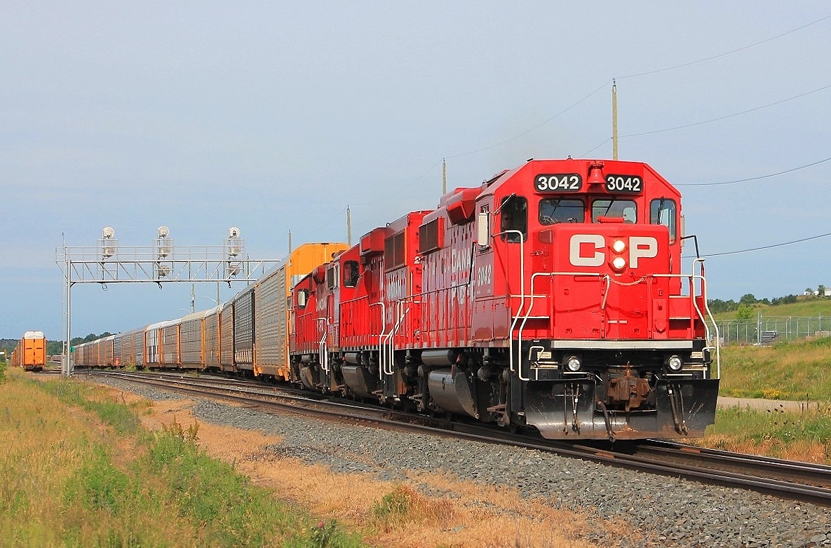 An early morning train of all Autoracks leaves the yard heading east with power from CP 3042,2263 & 3097.