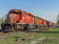 Faced with the limited options at the time of not having a car, I didn't have much options for pictures. With the shadows having already overtaken the overpass in the distance, this was my last resort in the fading light. CP 421 at the time still had EMD power quite frequently, but a solid six unit SD40-2 lashup was one of those twice a year things, and I used all the energy I had to bike to Essa. On this day, 421 was luckily working Utopia, and got there with just 10 minutes to spare. Unfortunately, 421 took the siding to wait for 420, greatly reducing the angle I could get of the power, however, all of it still managed to get into the shot. The power included CP 5988, 5953, 5959, 6072, 6040, 9006. After 421 cleared, I told myself, this will most likely be the last time I see an SD40 lashup of more than three units. And it was. The short lived oil boom started tapering off soon afterwards and was almost all but over by early 2015. 5988 was the only multimark unit in the consist, and outlived all the other five units in the consist. Alas, it was removed from service in December. While St. Paul still has five SD40-2's active for the hump yard, mainline duties, at least for now are history, after exactly 50 years of roaming the CP system. I had read somewhere that E.H.H. and his buds don't intend to buy new motive power for about six years, which in that case, perhaps an economy upturn can extend their life. For now though, lets enjoy the memories.