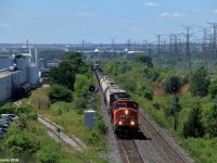 An extra M382 rolls under Weston Road with a duo of SD75I motors providing power, as they hustle to keep the train moving past CN Humber.