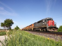 As summer begins to show itself finally, GEXR train 432 is about to cross Heritage Road in Norval, Ontario, bound for CN's Mac Yard. The regular trio of 3054 3393 3394 is back, after a few days/weeks with some yard power on the 431/432 cycle