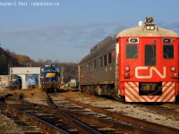 It's 0950 and CN 1501 has their headlight on in preparation to depart Hamilton, seen at  the CN/SOR Locomotive shop. Much of this is now gone including the motive power in the background, the RLK power was scrapped.