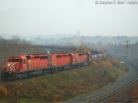 Posting this on a cloudy and dreary day, here's a cloudy and dreary day shot, for this young photographer, I didn't care about the weather. In fact, I didn't care about a lot of things - I cringe at the mistakes that I made at the time, photographically, and technically (!). But this one is kind of moody and well, I'd love a chance to do this again and do it right :) But some things you can't change. Witness the motive power on 230 (now 246) - never again in the lead position. Today's 246 (currently nearing Hamilton) has a pair of SD's enroute to the torch or the re-sale market.. and every single day this happened.. we took it for granted :)

