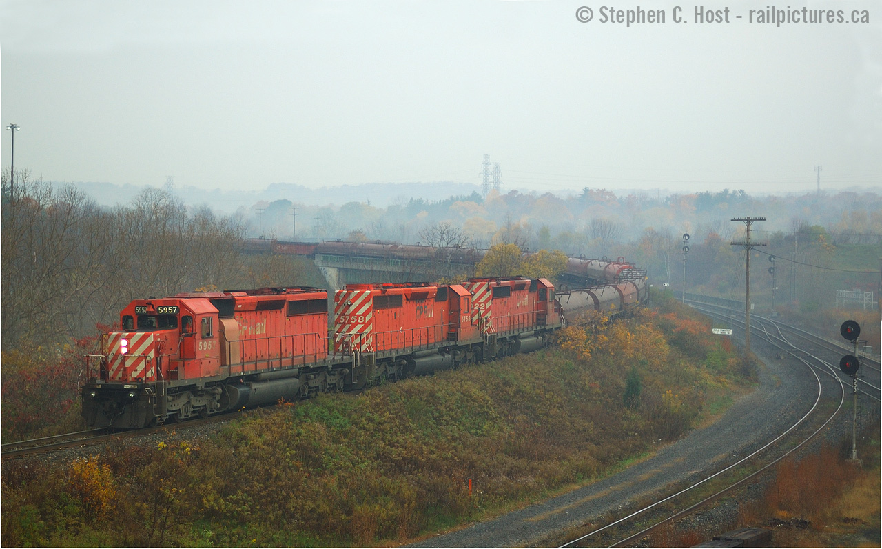 Posting this on a cloudy and dreary day, here's a cloudy and dreary day shot, for this young photographer, I didn't care about the weather. In fact, I didn't care about a lot of things - I cringe at the mistakes that I made at the time, photographically, and technically (!). But this one is kind of moody and well, I'd love a chance to do this again and do it right :) But some things you can't change. Witness the motive power on 230 (now 246) - never again in the lead position. Today's 246 (currently nearing Hamilton) has a pair of SD's enroute to the torch or the re-sale market.. and every single day this happened.. we took it for granted :)