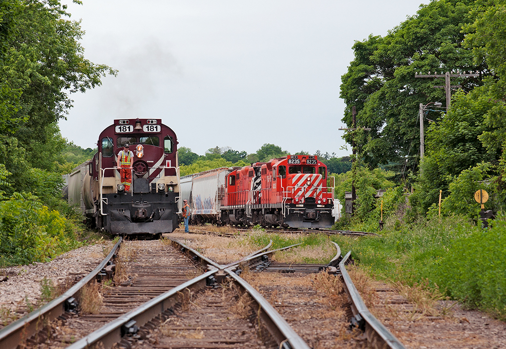 It's somewhat busy in the lower yard up in Guelph, Job One has arrived from the other end of Guelph after working Traxxside, PDI Massey Rd and the CN Interchange. The first job will set out 5 loads out from the CN interchange into Lower Yard One, 1 CN car from Traxxside to be weighed then brought back for the interchange to GEXR/CN, 2 plastic cars for PDI Elizabeth St, 1 Maleic Acid car for AOC and a PAO tank car from Chemtura in Elmira for the Liquid Yard. My assignment, Job Two sits and waits for the other job to finish before we continue to switch out PDI Elizabeth St. and then PDI Liquid.