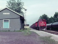 One chance I get to catch a freight while in the village of Wyoming, ON.,and for obvious safety reasons I cannot cross the tracks. So this is what I get. CN 9476, 9589 and 9479, a trio of GP40-2L(W, really blew thru here; was caught off guard by the speed limit. Must have been 55 MPH at least. For what its worth, I did make note the caboose on the end of train was #79438.  I do not recall the next time I managed to get out to the station for another action shot,(maybe 1979) but when I did, the building was gone.